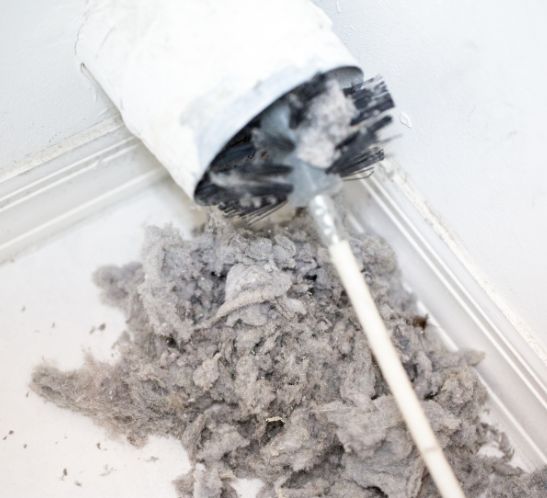 Lint buildup inside a dryer vent duct posing a fire hazard